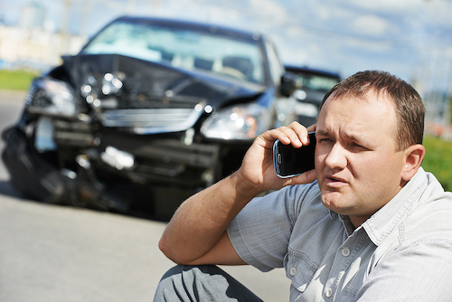 a car crash with man on phone
